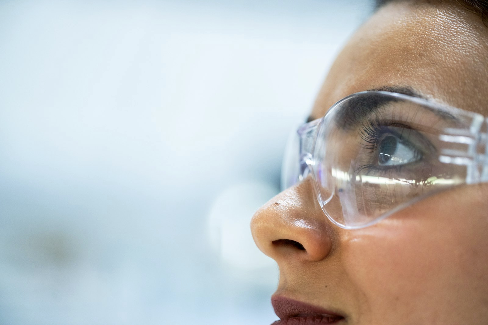 Researcher in protective glasses
