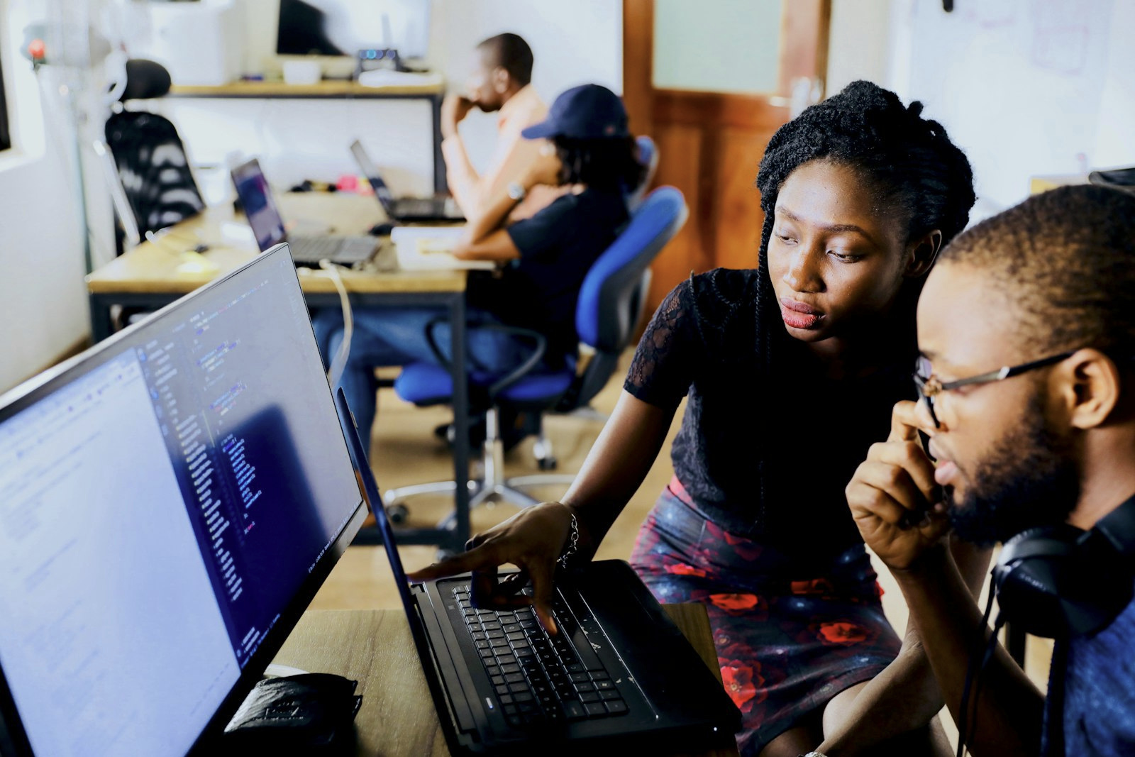 Two engineers reviewing code together